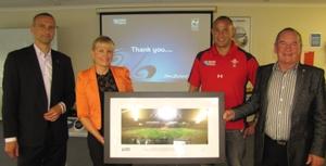 RNZ 2011 General Manager Andrew Steele, TDC's RWC 2011 Project Manager Karen Balasoglou, Deputy Mayor Mike Downard, and Mayor Rick Cooper holding the framed image of Eden Park.